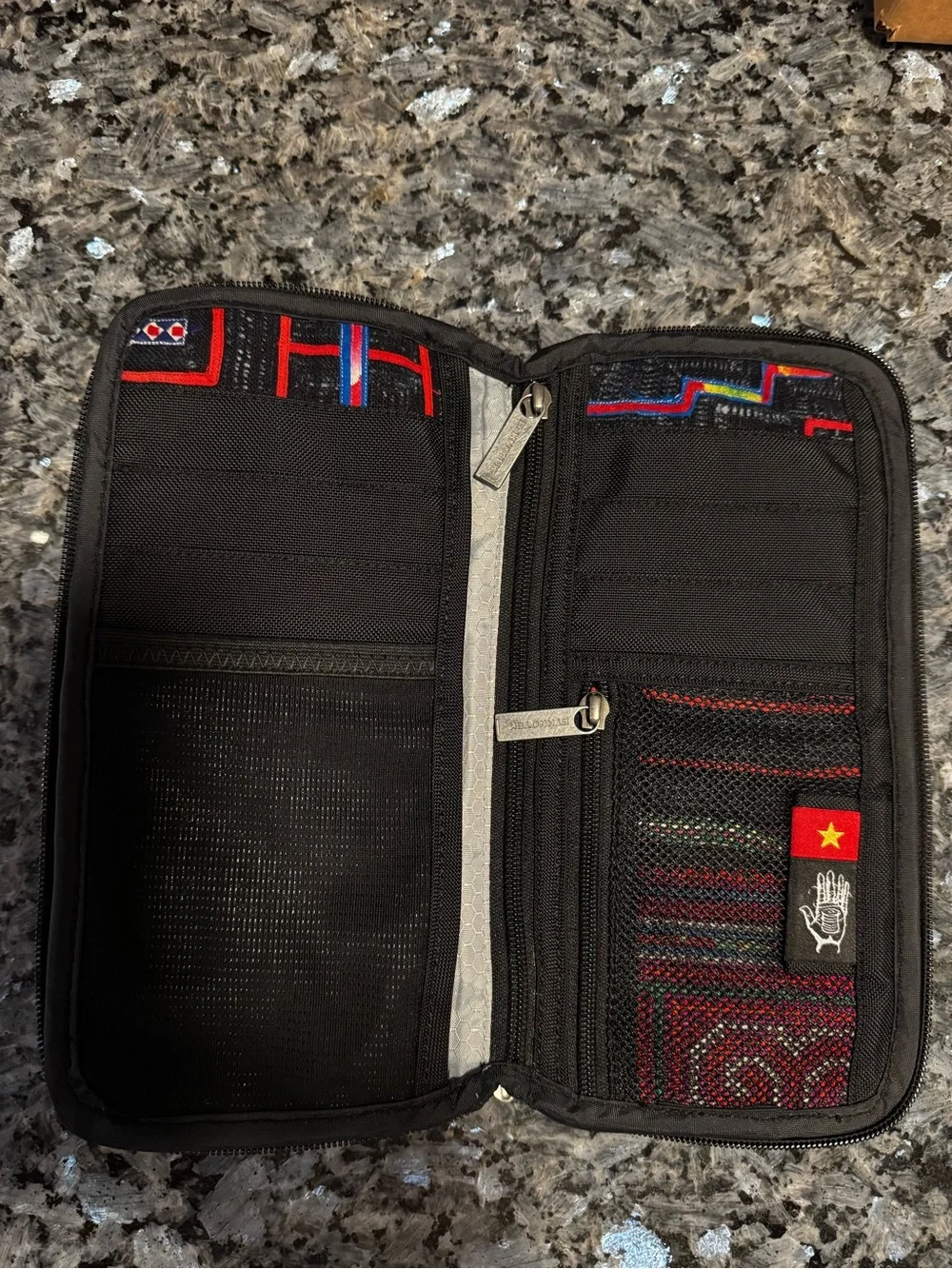 Ethnotek Chiburi travel wallet. Multiple pockets for cash, passport, phone.
